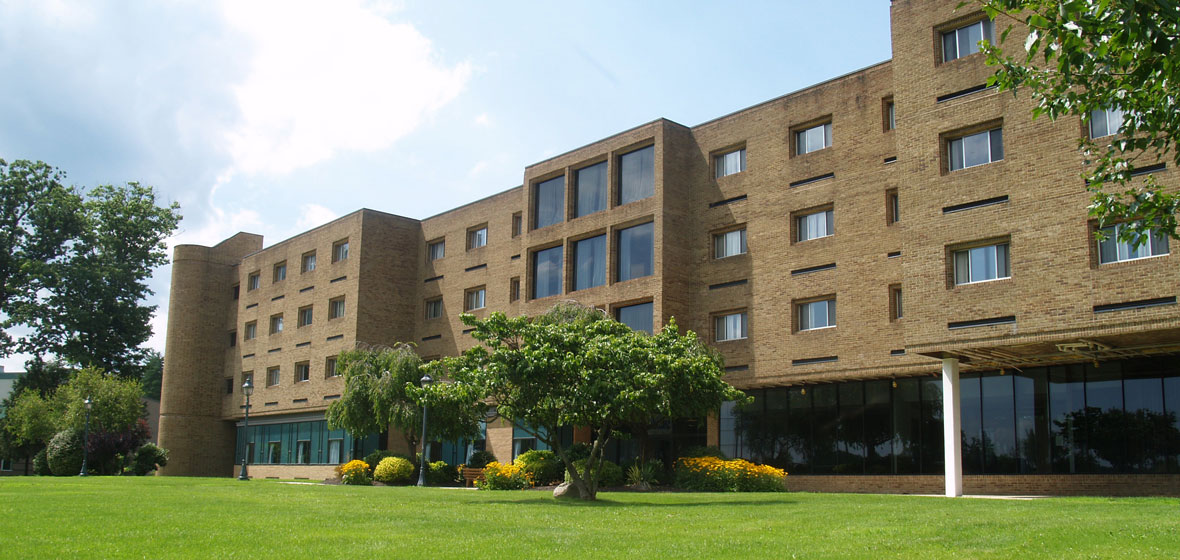 campus, modern building with lush green grass