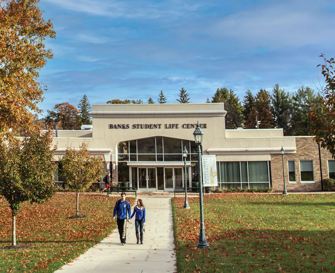 students walking to Banks Student Life Center building in the fall
